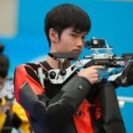 China Huang Wins First Gold