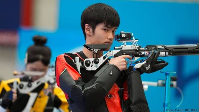 China Huang Wins First Gold